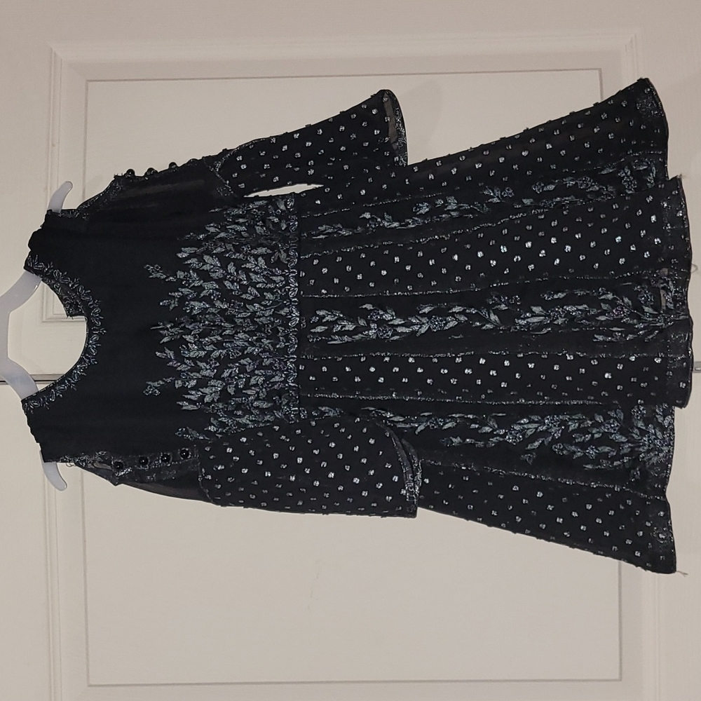 Dress and pants set for a girl.
